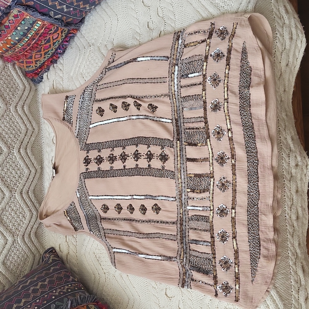 Women's beaded tan tank top.